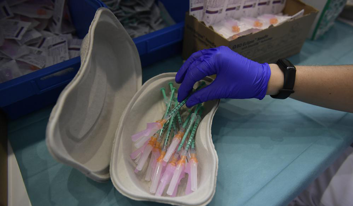 WHO chief urges halt to booster shots for rest of the year