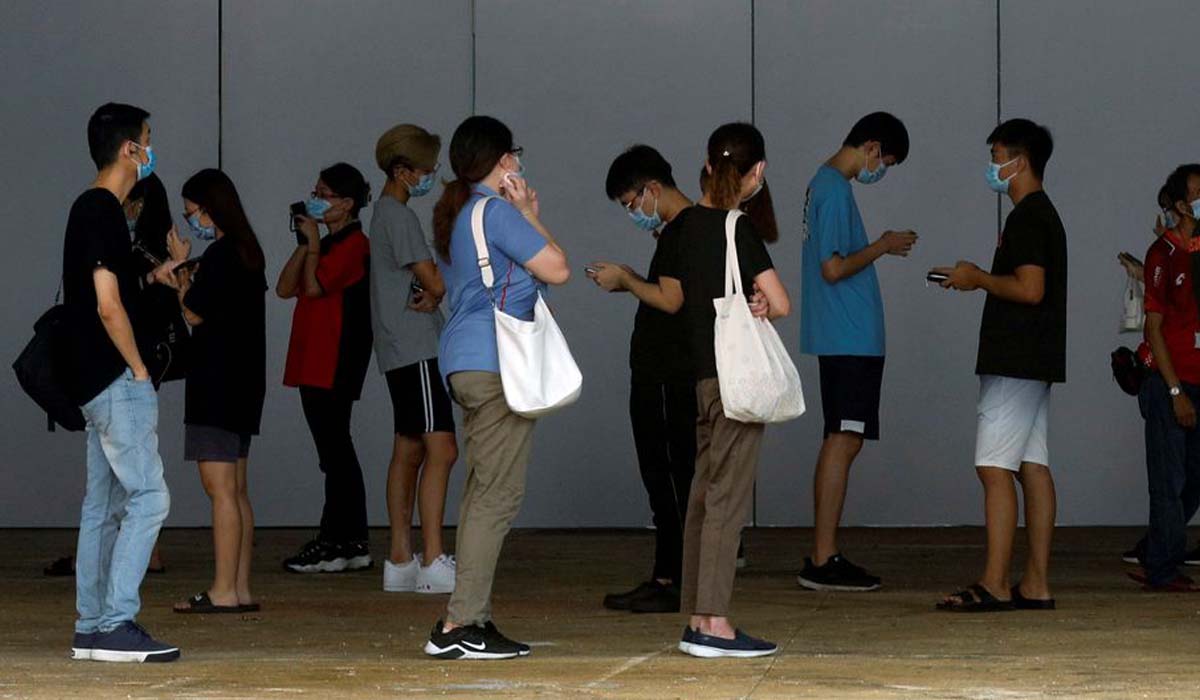 Singapore advises unvaccinated people to stay home as cases rise